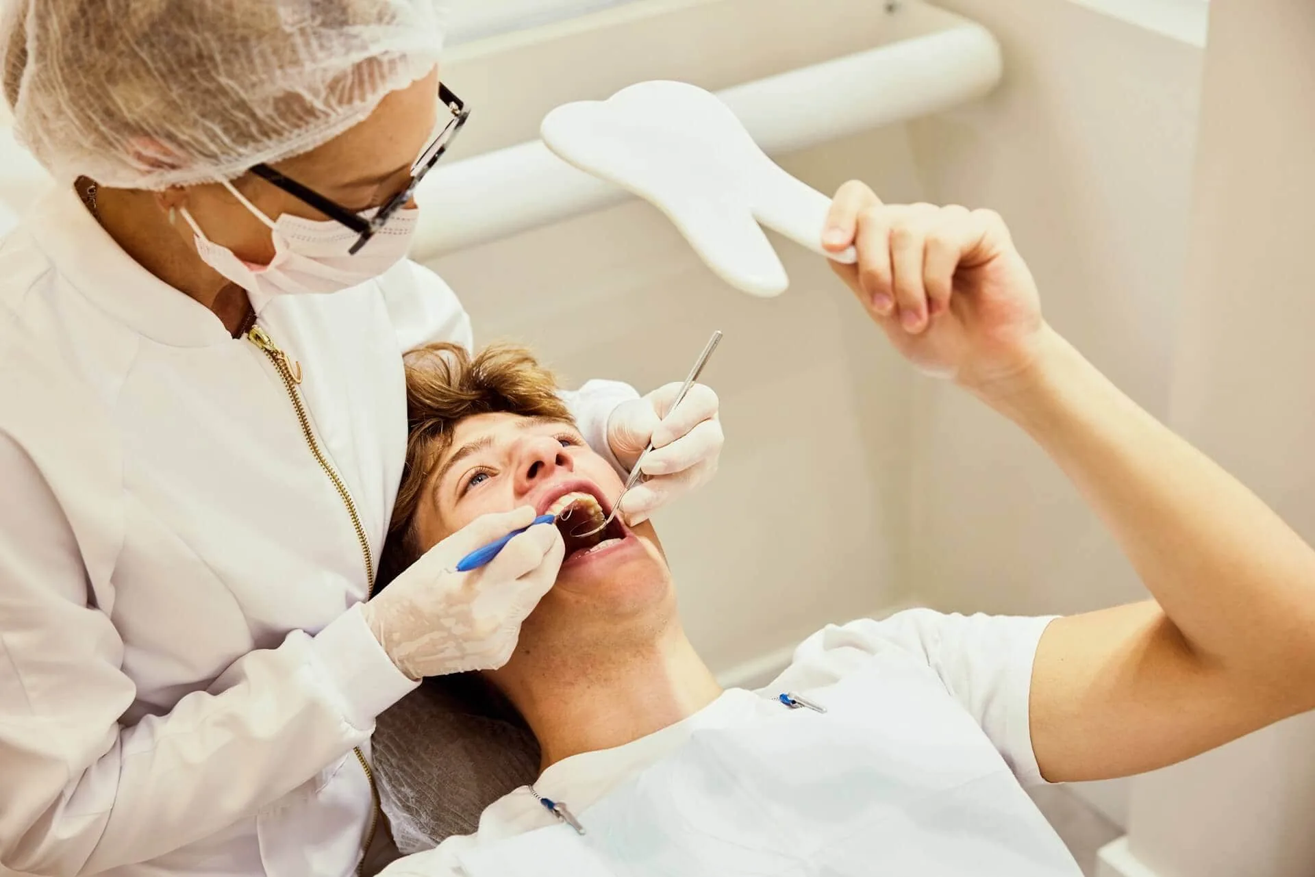 A dentist working on a patient