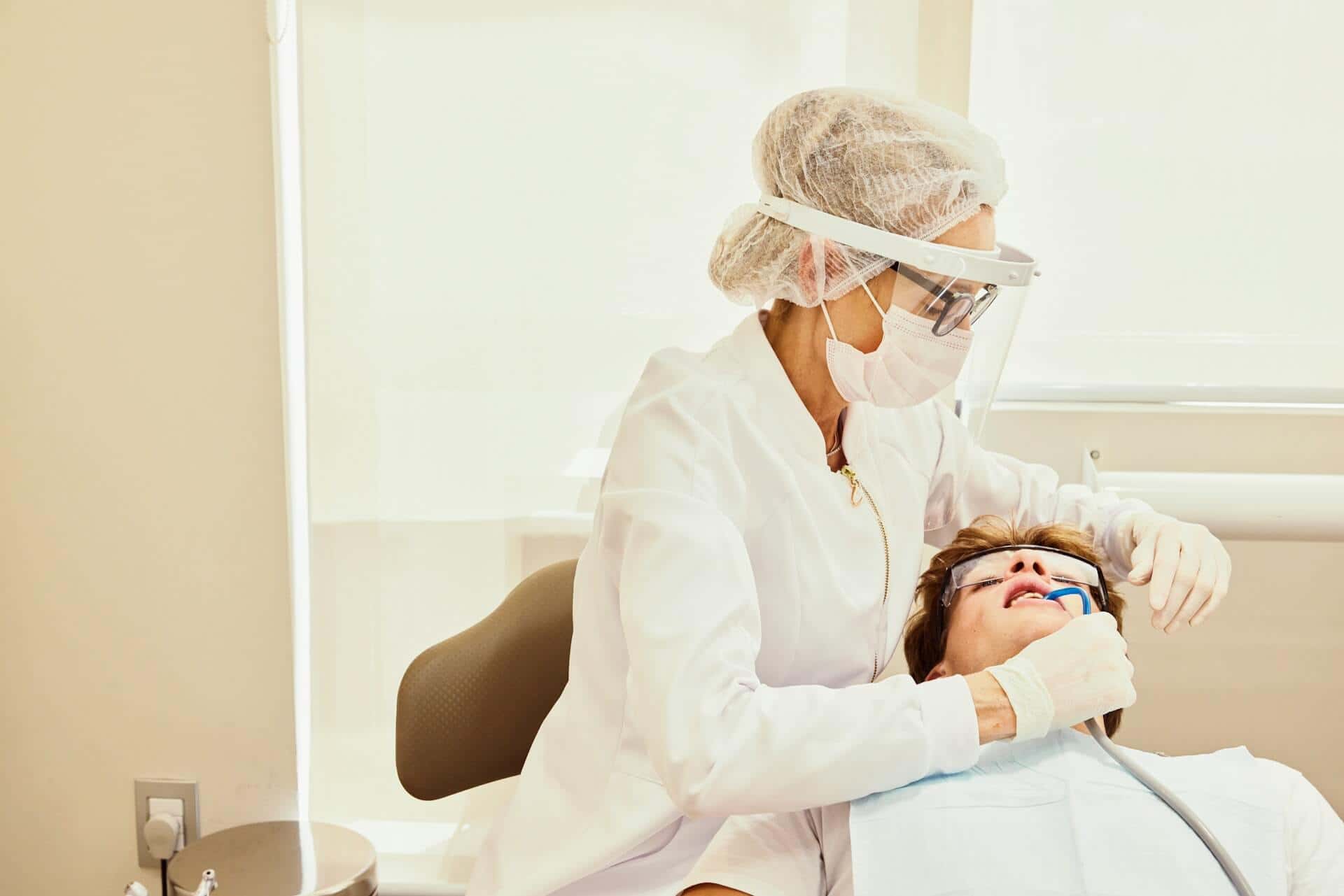 A woman working on a patient