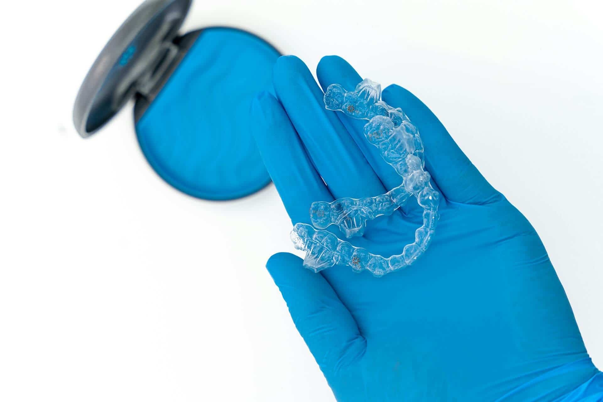 A photo of a hand holding a veneers