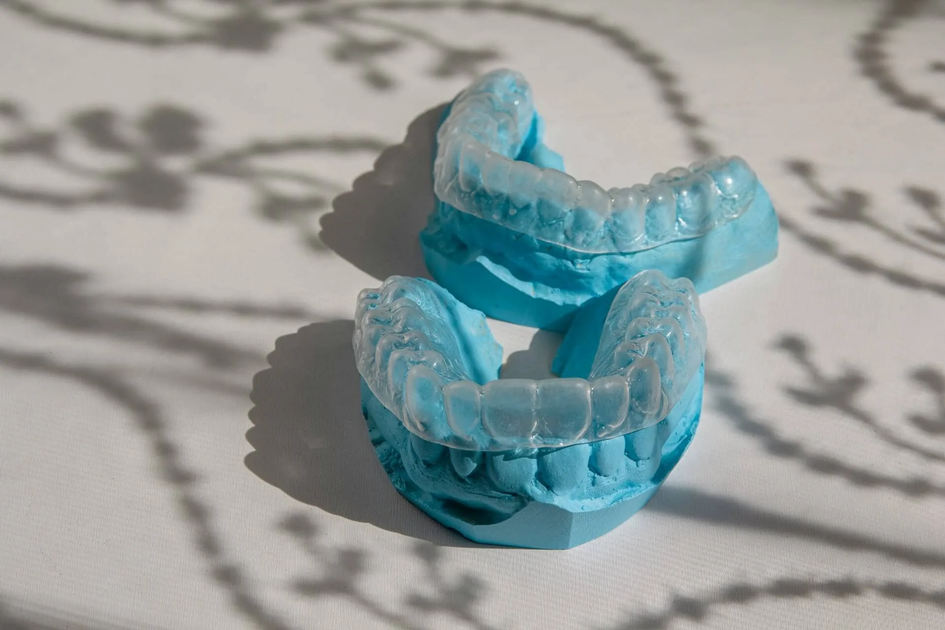 Two invisalign on a blue mold