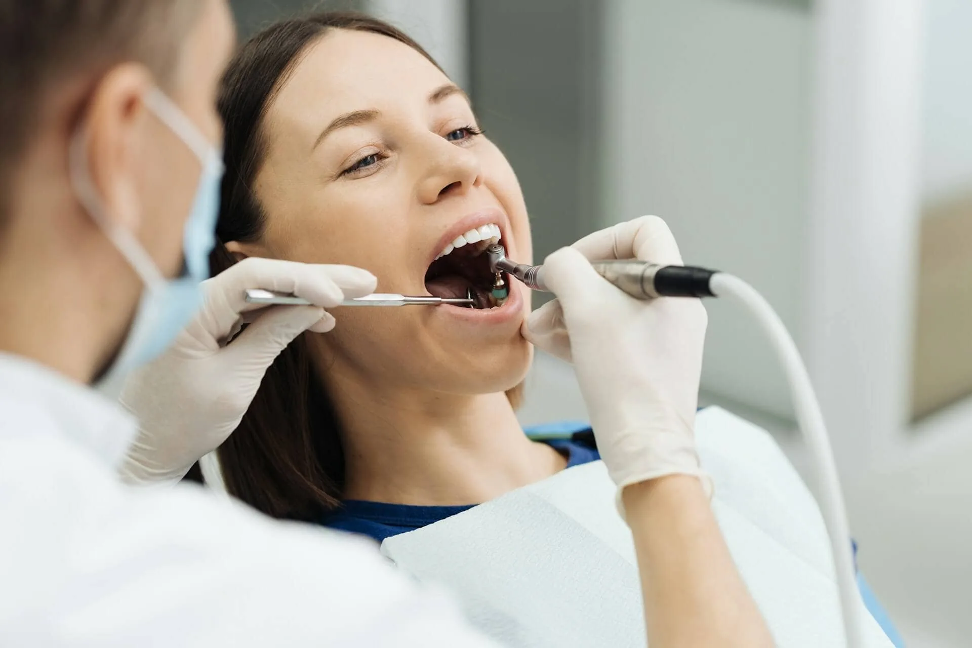A woman being worked on by a dentist